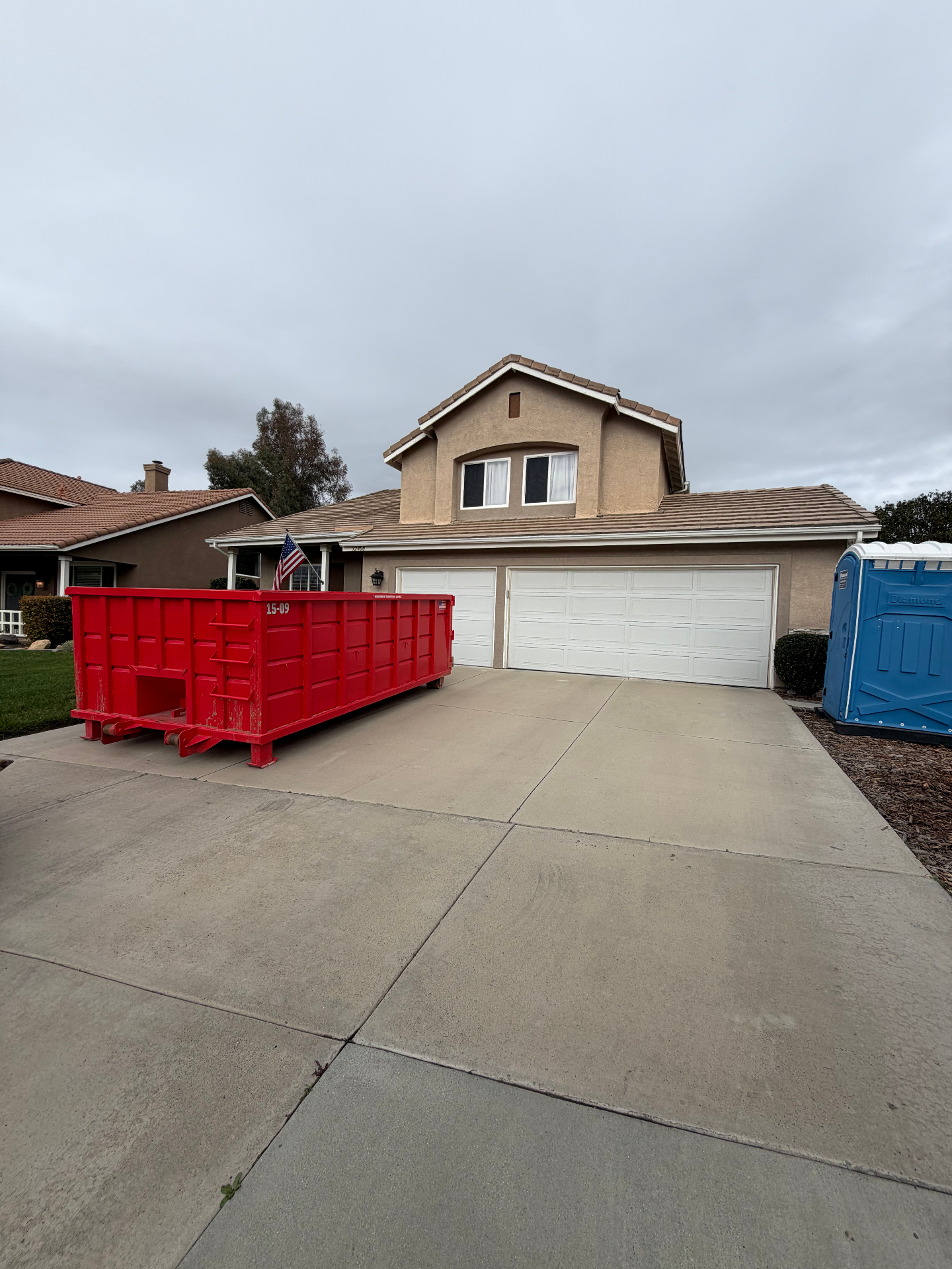Victory Dumpster Rentals roll-off dumpster in a residential neighborhood in Murrieta, CA