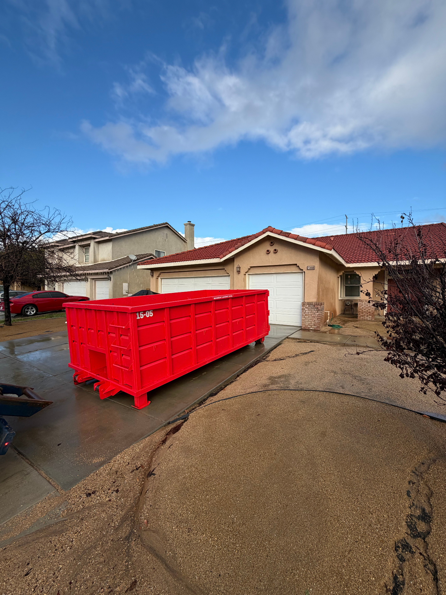 Victory Dumpster Rentals roll-off dumpster in a residential neighborhood in Temecula, CA